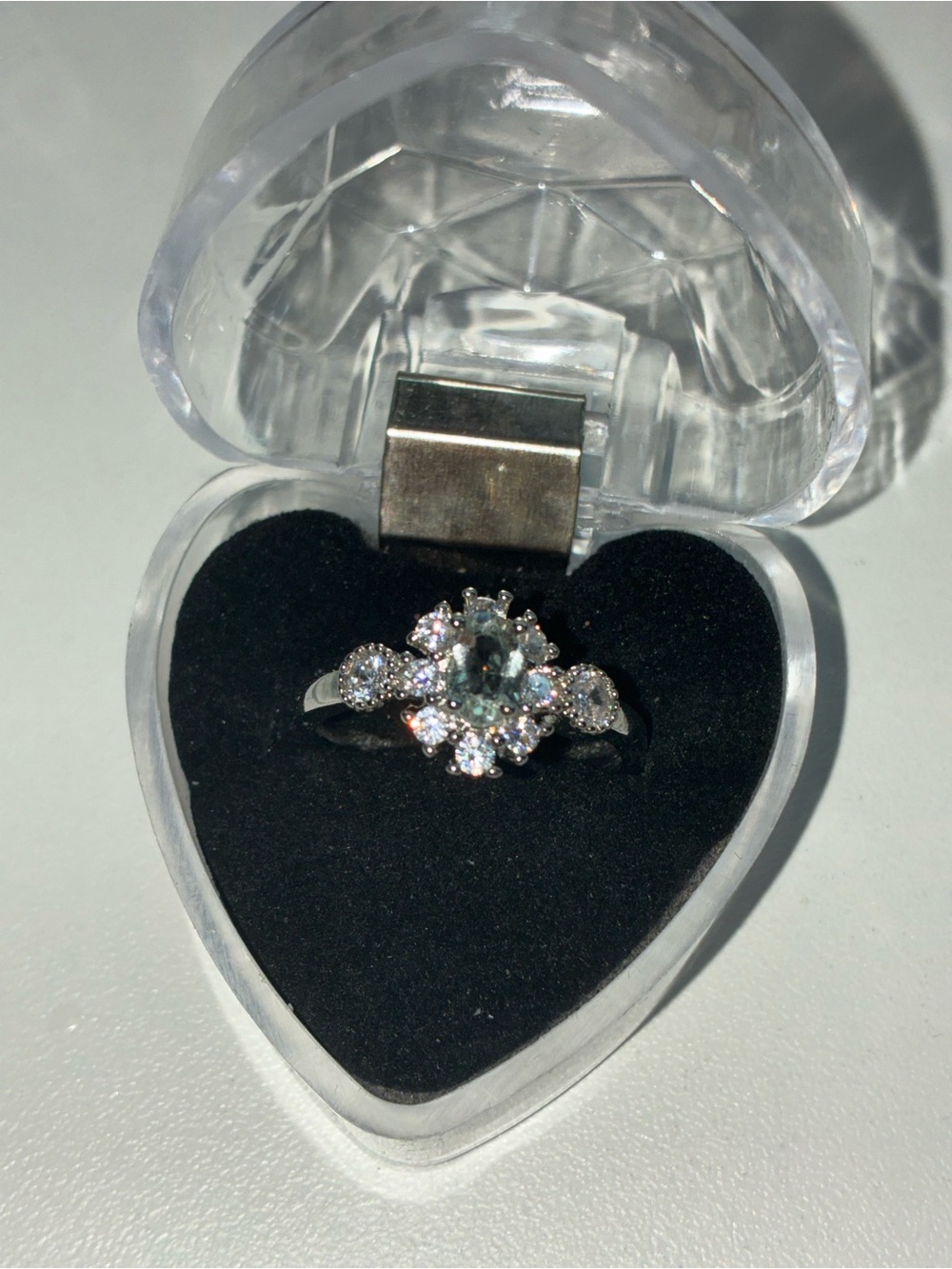 Silver Halo Flower Ring with Light Green Center Stone